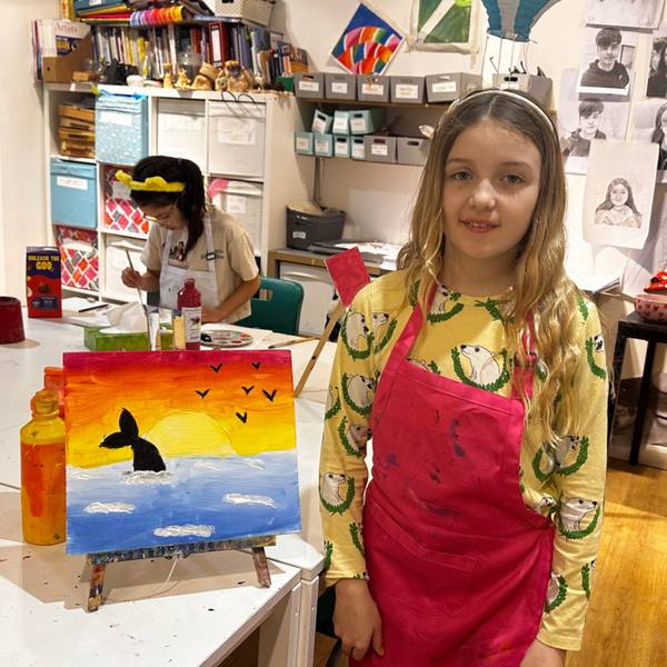 A child with a sunset painting