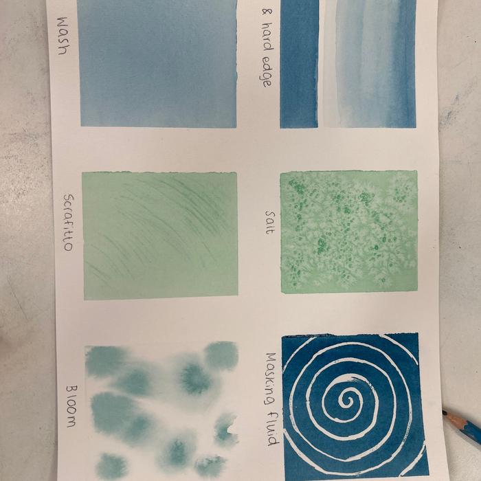 Watercolour wash and texture exercises on a practice sheet
