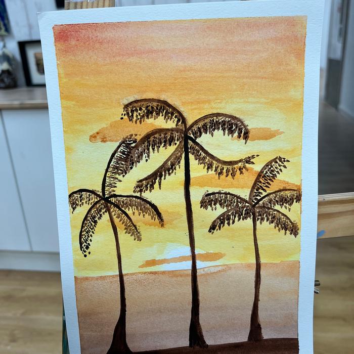 Watercolour of palm trees against a sunset sky
